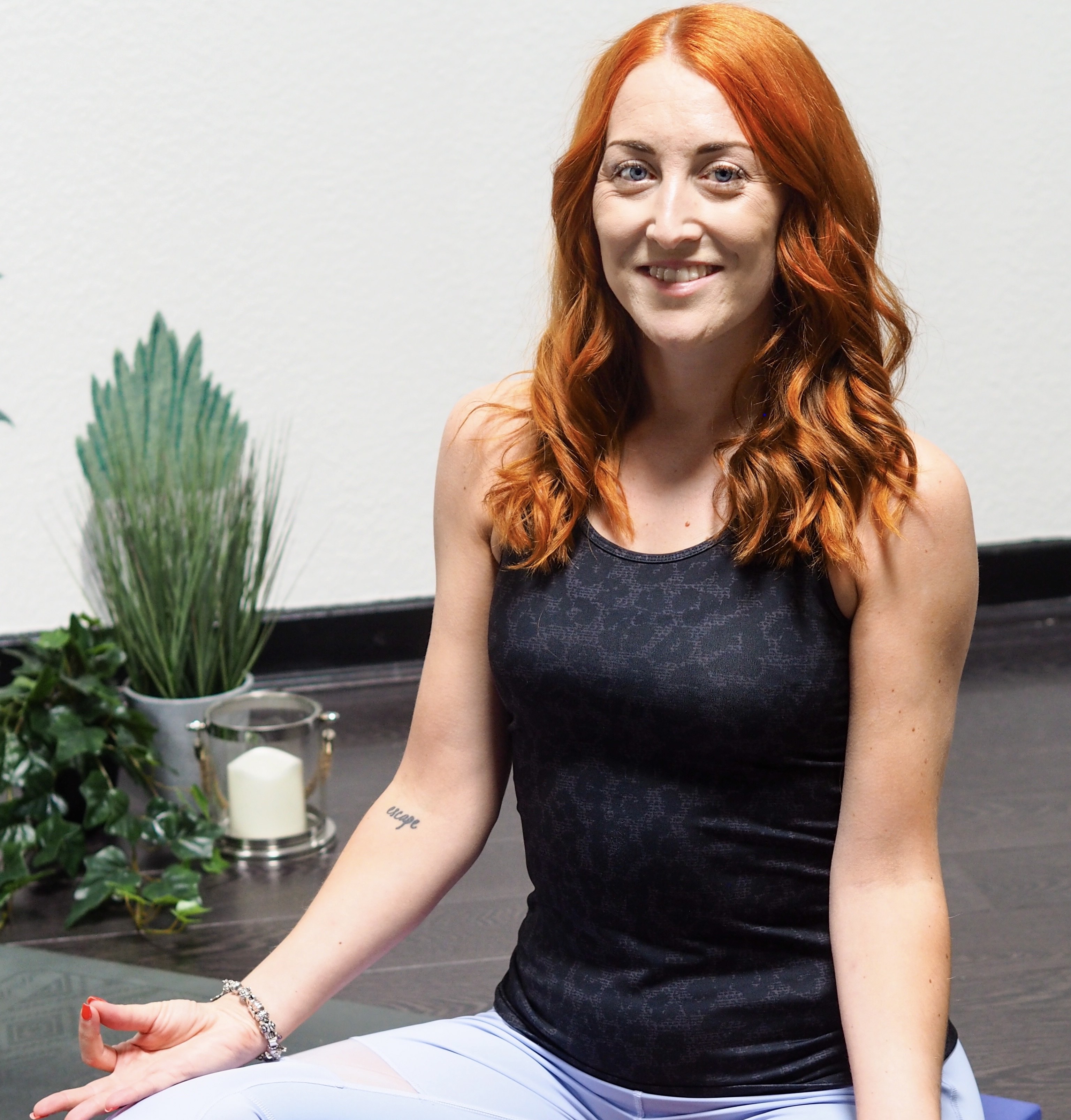 Sophia seated and smiling, facilitating a sharing circle